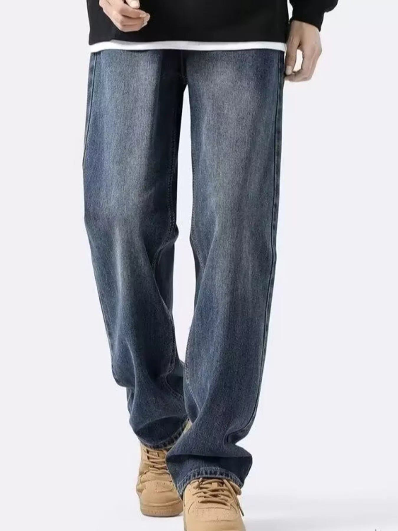 NEWYORKLISTED ATLAS MEN's COLLECTION: Person wearing blue jeans and tan shoes on a white background