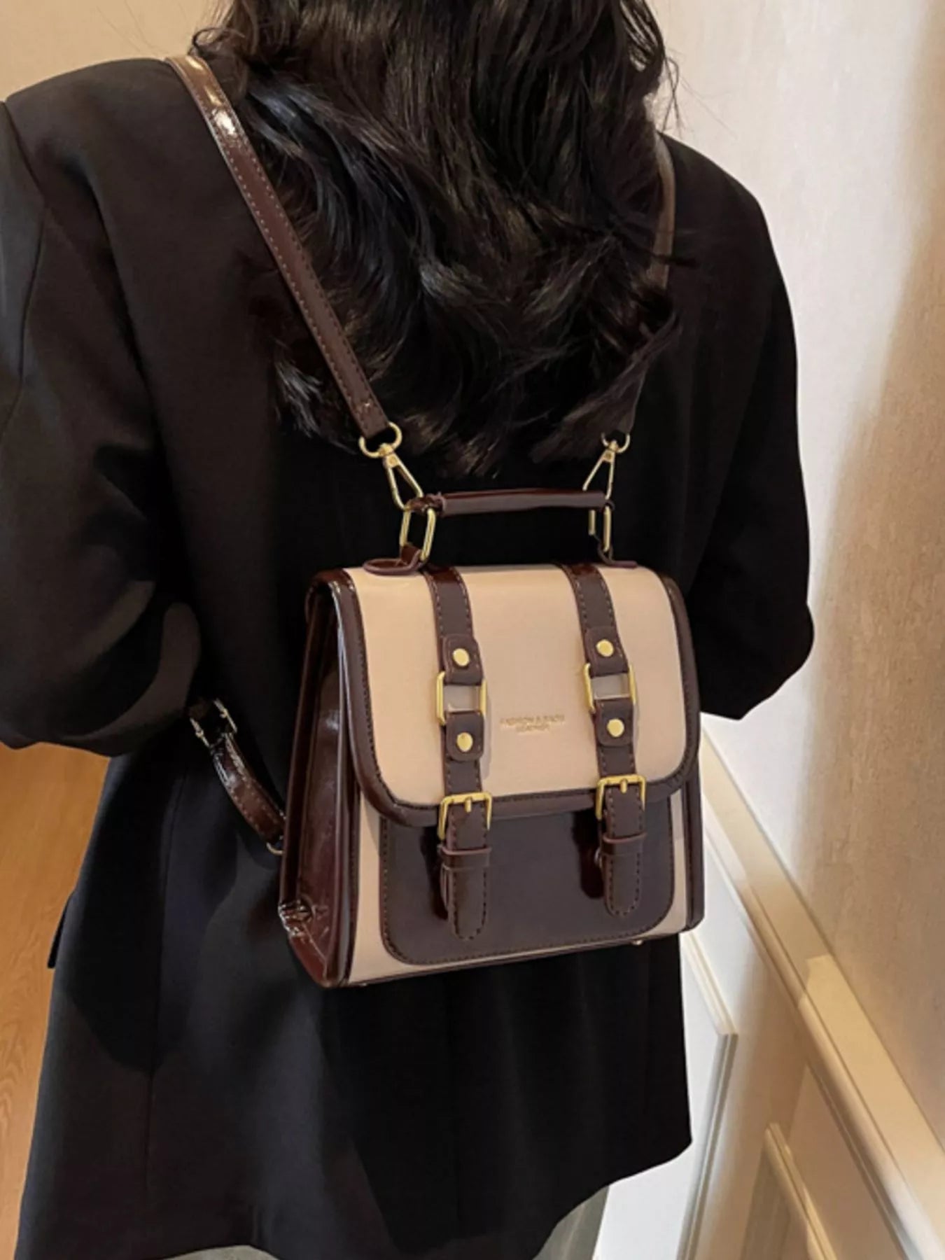 NEWYORKLISTED STYLE COLLECTION: Person wearing a brown and beige backpack indoors