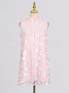 NEWYORKLISTED STYLE COLLECTION: Pink floral dress on a mannequin against a gray background