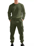 NEWYORKLISTED ATLAS MEN'S COLLECTION: A man wearing a matching olive green waffle-knit sweatshirt and jogger pants set with cargo pockets, shown against a plain white background.