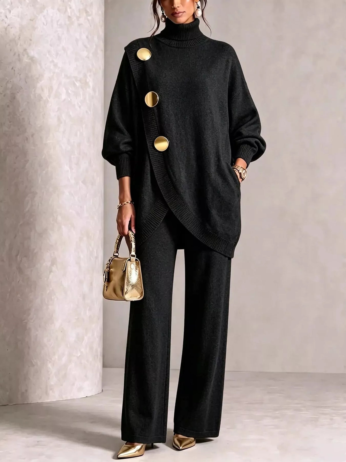 NEWYORKLISTED STYLE COLLECTION:  A model wearing a black knit turtleneck sweater with oversized sleeves and three prominent gold buttons, paired with black wide-leg trousers and holding a small metallic gold handbag.