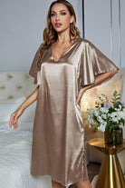 NEWYORKLISTED Intimate Apparel: Woman wearing a satin nightgown in a bedroom setting