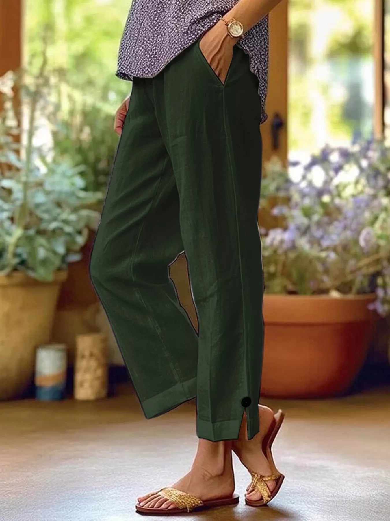 NEWYORKLISTED STYLE COLLECTION: Person wearing green pants with a blurred indoor background