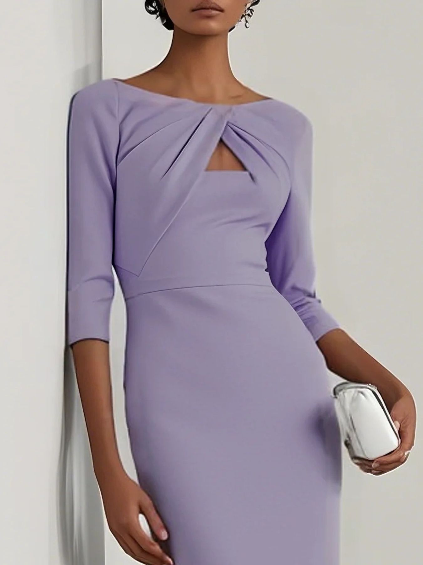 NEWYORKLISTED STYLE COLLECTION: Woman wearing a lavender dress with a plain background