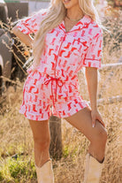 NEWYORKLISTED Intimate Apparel: Woman wearing a pink and red patterned romper in a field