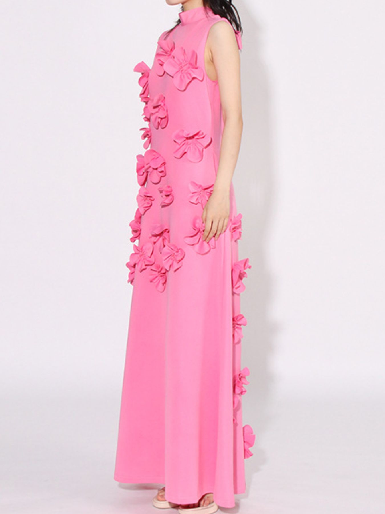 NEWYORKLISTED STYLE COLLECTION: Pink evening gown with floral embellishments on a white background