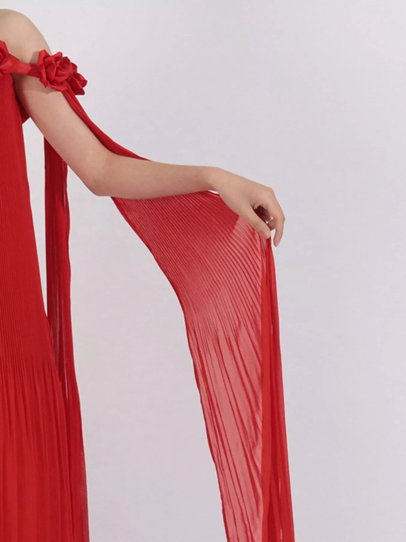 NEWYORKLISTED STYLE COLLECTION: Red dress with floral details on a white background