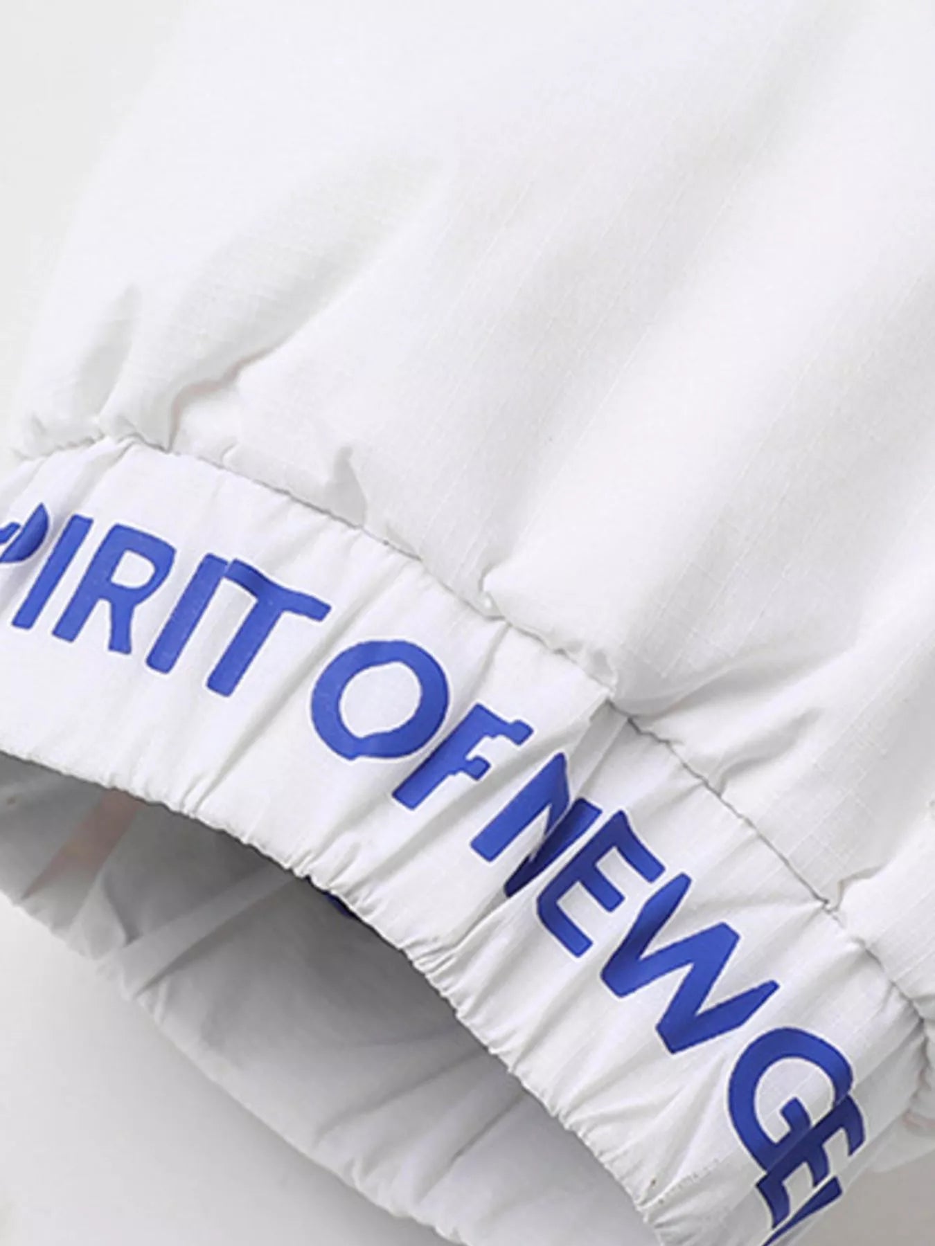 NEWYORKLISTED ATLAS MEN’S COLLECTION: White puffer jacket with blue text on a white background