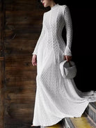 NEWYORKLISTED STYLE COLLECTION: Woman wearing a white lace dress holding a gray bag against a wooden background
