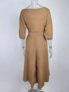 NEWYORKLISTED STYLE COLLECTION: Brown dress on a mannequin against a white background