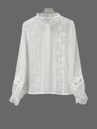 NEWYORKLISTED STYLE COLLECTION: White lace blouse on a gray background