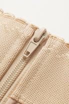 NEWYORKLISTED Intimate Apparel: Close-up of a beige zipper on a textured fabric background