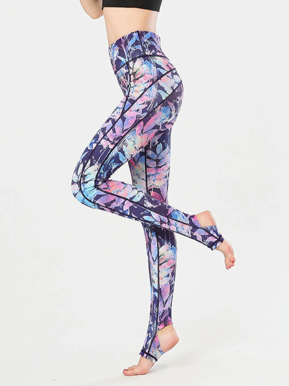 NEWYORKLISTED ACTIVEWEAR COLLECTION: Multicolored patterned leggings worn by a person on a white background