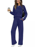 NEWYORKLISTED COMFORT COLLECTION: Woman wearing a blue outfit holding a coffee cup on a white background