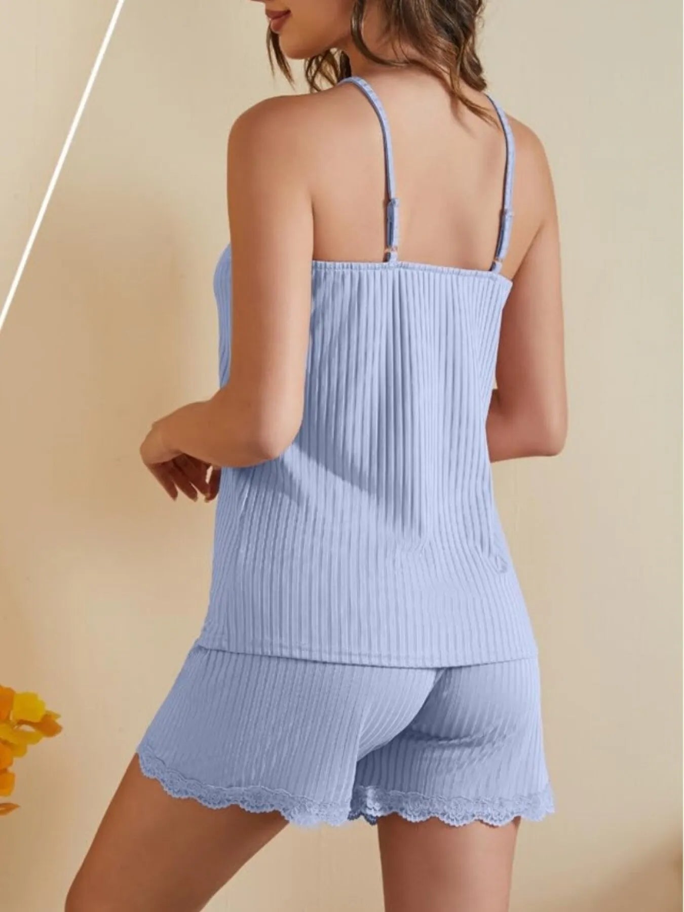 NEWYORKLISTED Intimate Apparel: Light blue ribbed pajama set with lace trim on a beige background