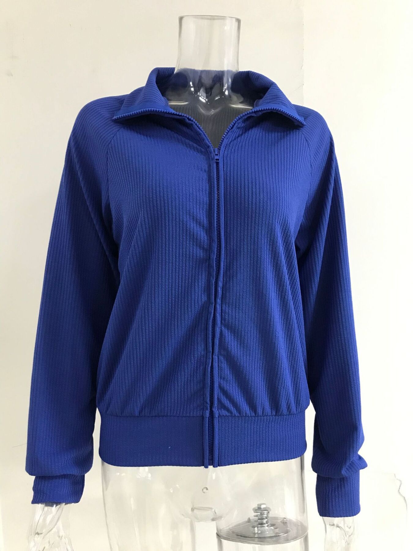 NEWYORKLISTED STYLE COLLECTION: Blue jacket on a mannequin against a white background