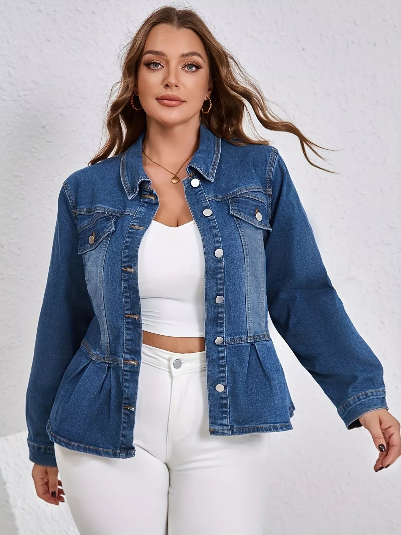 NEWYORKLISTED STYLE COLLECTION: Woman wearing a blue denim jacket over a white top and pants on a light gray background