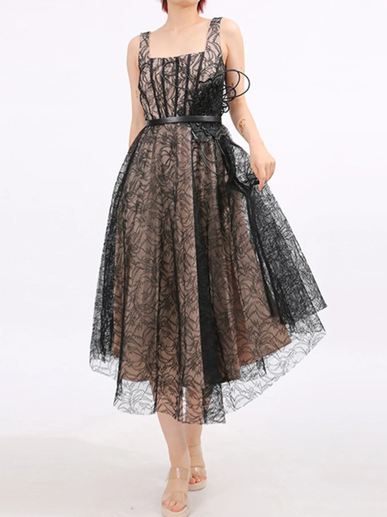 NEWYORKLISTED RUNWAY STYLE: Black lace dress with a belt on a white background
