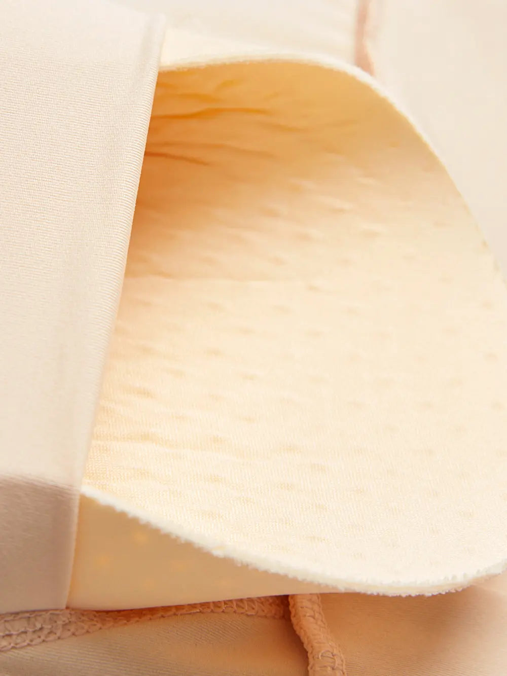 NEWYORKLISTED Intimate Apparel: Close-up of a beige fabric texture