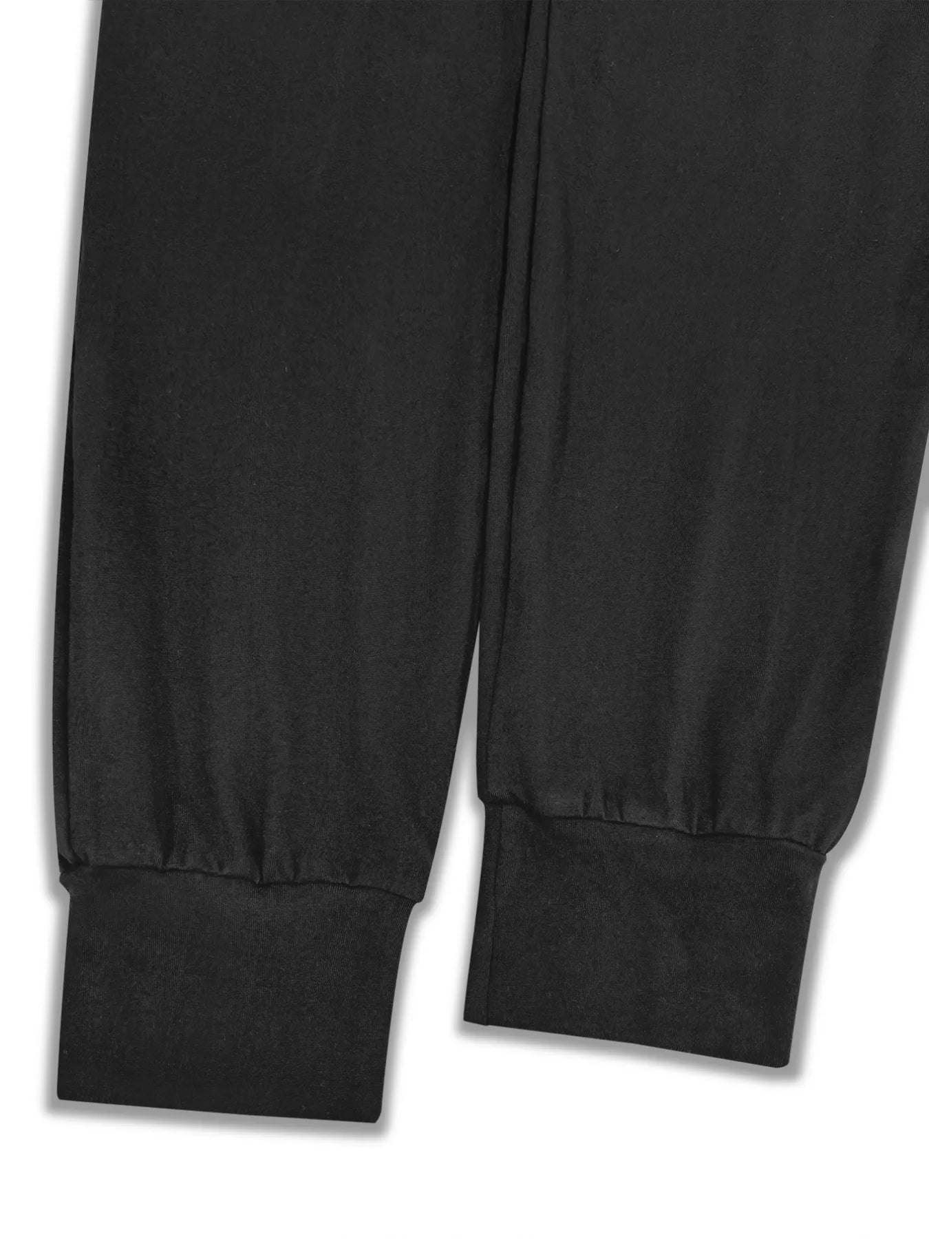 NEWYORKLISTED STYLE COLLECTION: Close-up of black pants with a white background