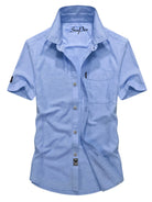 NEWYORKLISTED ATLAS MEN'S COLLECTION: Light blue short-sleeve button-up shirt on a white background