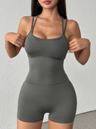 NEWYORKLISTED ACTIVEWEAR COLLECTION: Woman wearing a gray athletic outfit against a white background