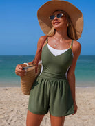 NEWYORKLISTED EDEN COLLECTION: Woman in a green romper and straw hat on a beach
