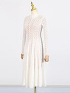 NEWYORKLISTED STYLE COLLECTION: White lace dress on a mannequin against a white background