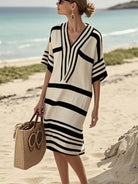 NEWYORKLISTED STYLE COLLECTION: Woman in a black and white striped dress on a beach