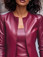 NEWYORKLISTED STYLE COLLECTION: Close-up of a person wearing a burgundy leather jacket.