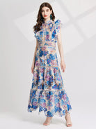 NEWYORKLISTED STYLE COLLECTION: Woman wearing a floral dress on a white background