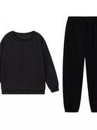 NEWYORKLISTED COMFORT COLLECTION: Black sweatshirt and black pants on a white background