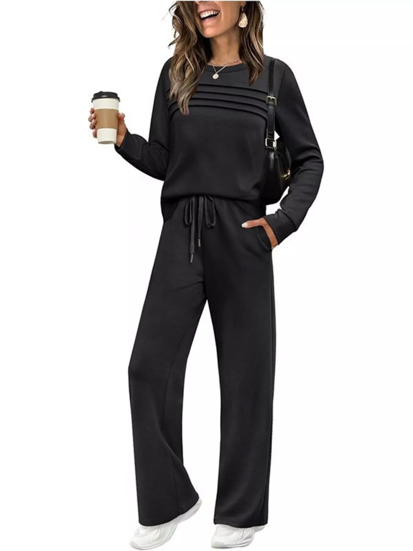 NEWYORKLISTED COMFORT COLLECTION: Woman wearing a black outfit with a white background