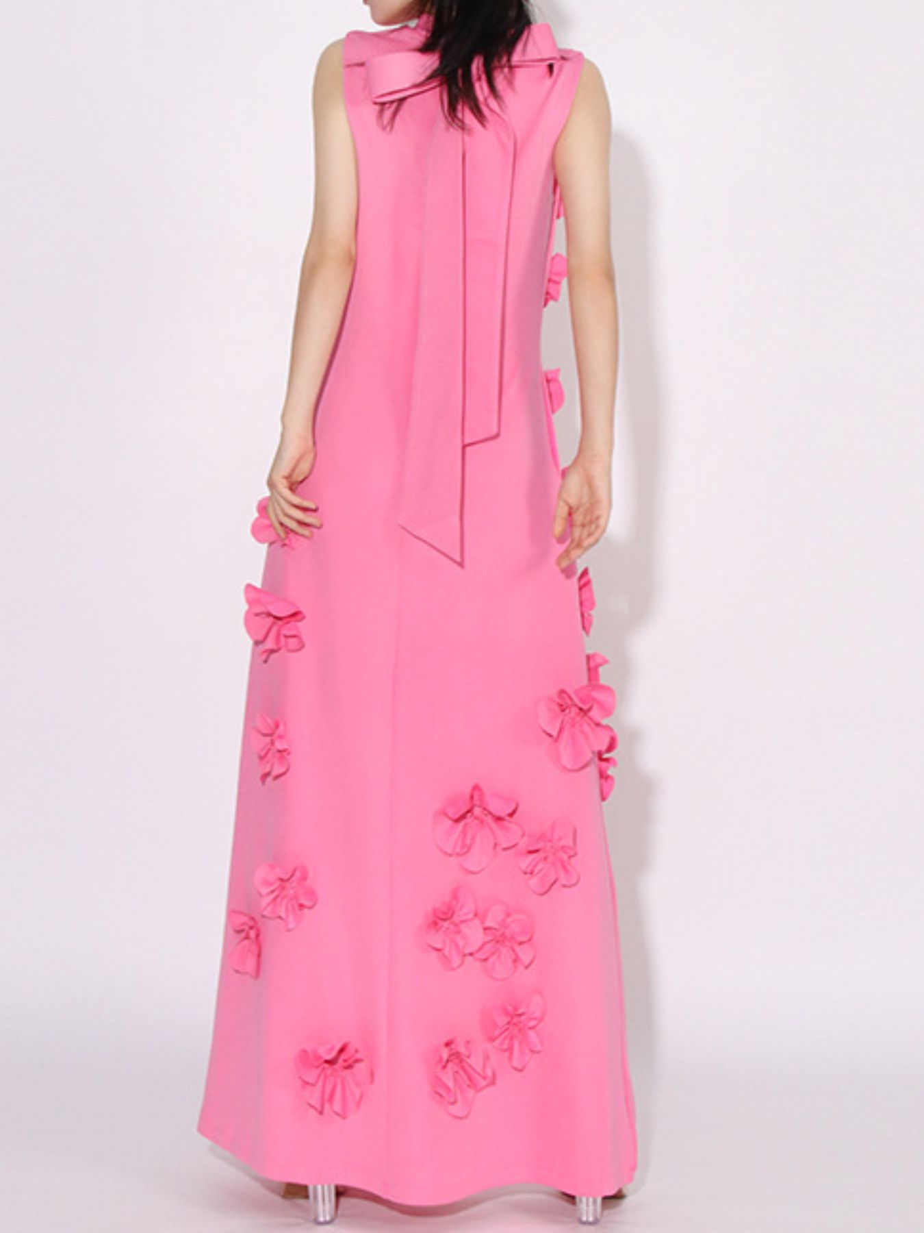 NEWYORKLISTED STYLE COLLECTION: Pink dress with floral embellishments on a white background