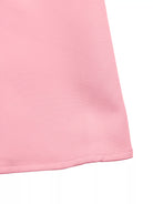 NEWYORKLISTED STYLE COLLECTION: Close-up of a pink fabric corner on a white background
