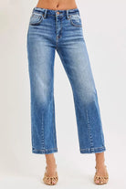 NEWYORKLISTED DENIM COLLECTION: Blue jeans worn by a person on a white background