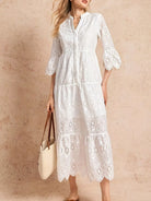 NEWYORKLISTED STYLE COLLLECTION: Woman wearing a white lace dress against a beige background