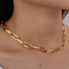 NYLD Glamour Collection by NEWYORKLISTED: Gold chain necklace on a person's neck