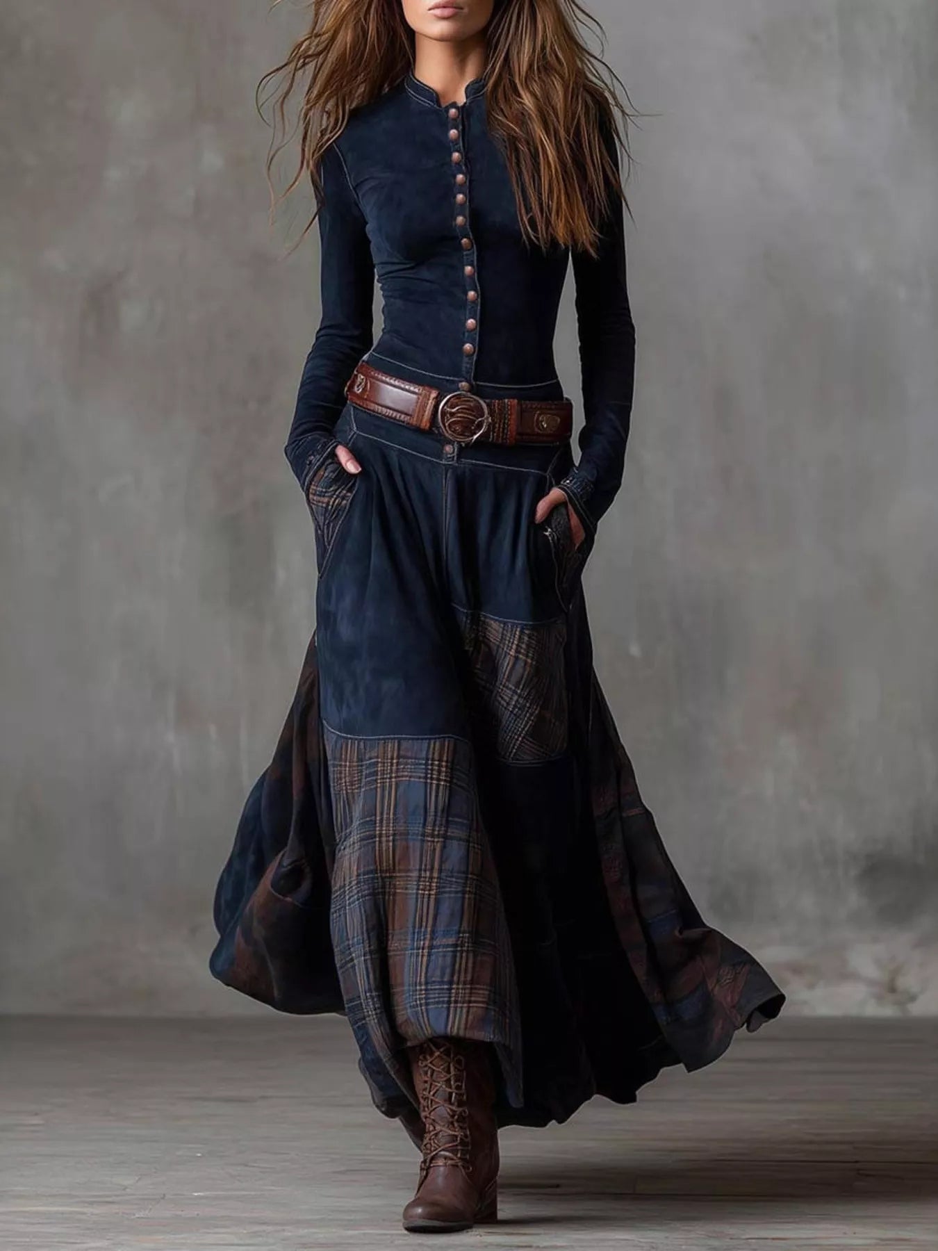 NEWYORKLISTED Style Collection: Woman wearing a long, dark blue dress with plaid pattern and brown belt against a gray background