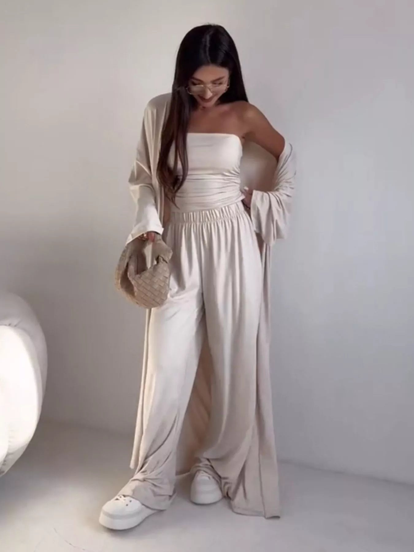 NEWYORKLISTED COMFORT COLLECTION: Woman wearing a white outfit with a plain background