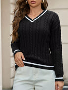 NEWYORKLISTED STYLE COLLECTION: Person wearing a black cable knit sweater with white trim