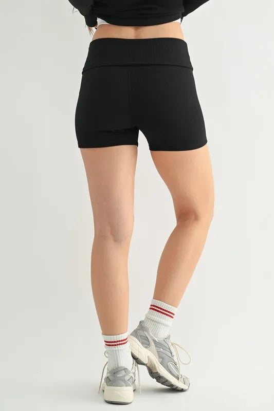 NEWYORKLISTED ACTIVEWEAR: Person wearing black high-waisted shorts on a plain background
