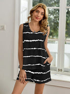 NEWYORKLISTED Intimate Apparel: Woman wearing a black and white striped sleeveless top and shorts set indoors.