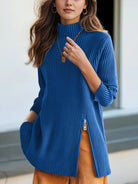 NEWYORKLISTED STYLE COLLECTION: Woman wearing a blue ribbed sweater with a blurred background