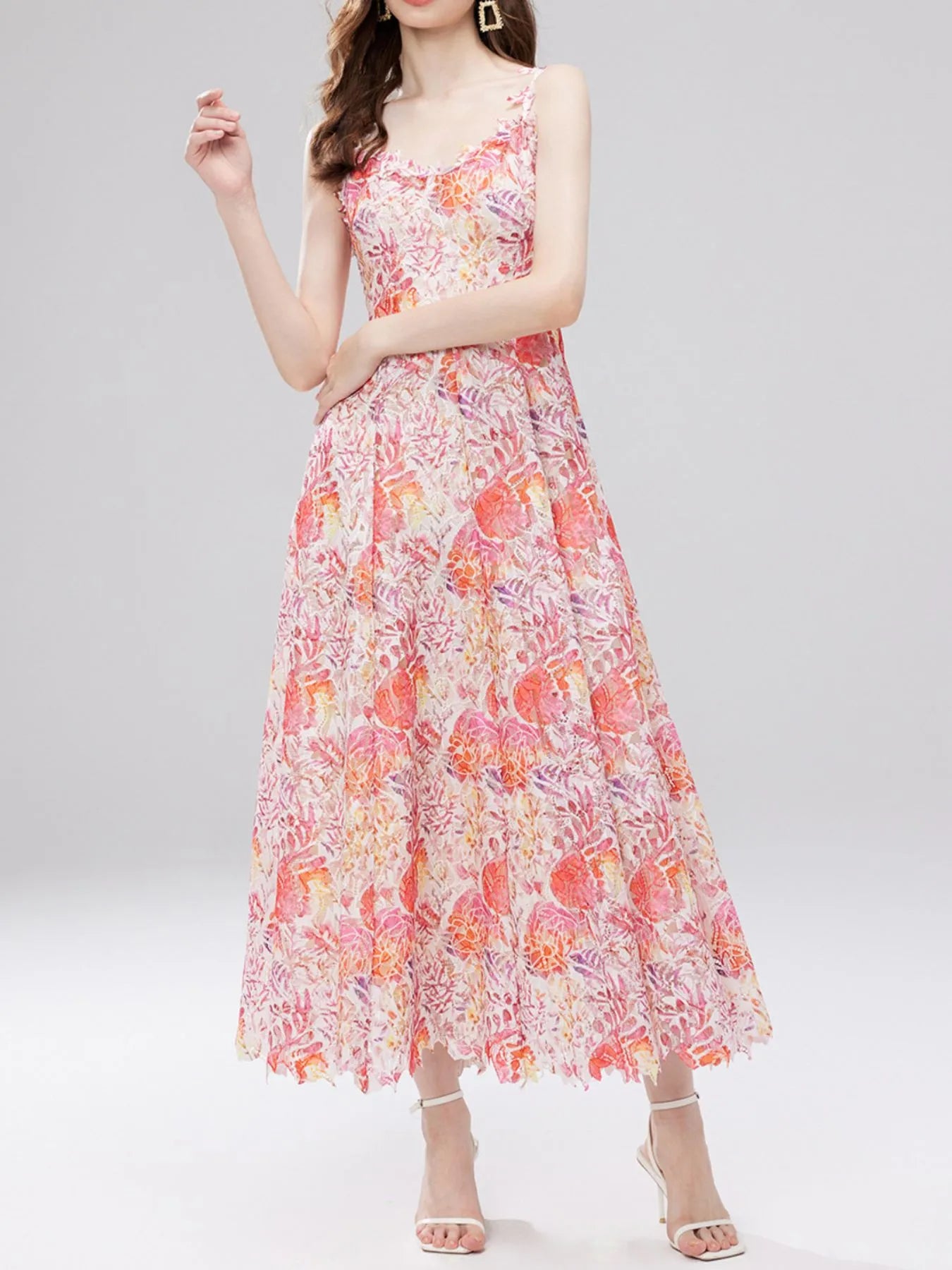NEWYORKLISTED STYLE COLLECTION: Woman wearing a floral dress on a gray background