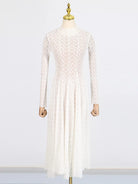 NEWYORKLISTED STYLE COLLECTION: White lace dress on a mannequin against a white background