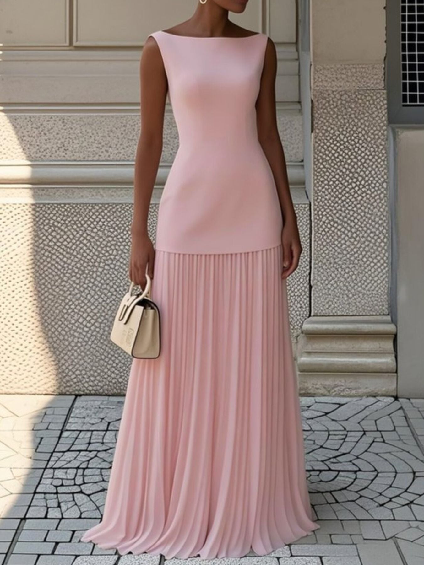 NEWYORKLISTED STYLE COLLECTION: Woman wearing a pink dress standing on a stone pavement with a textured wall background
